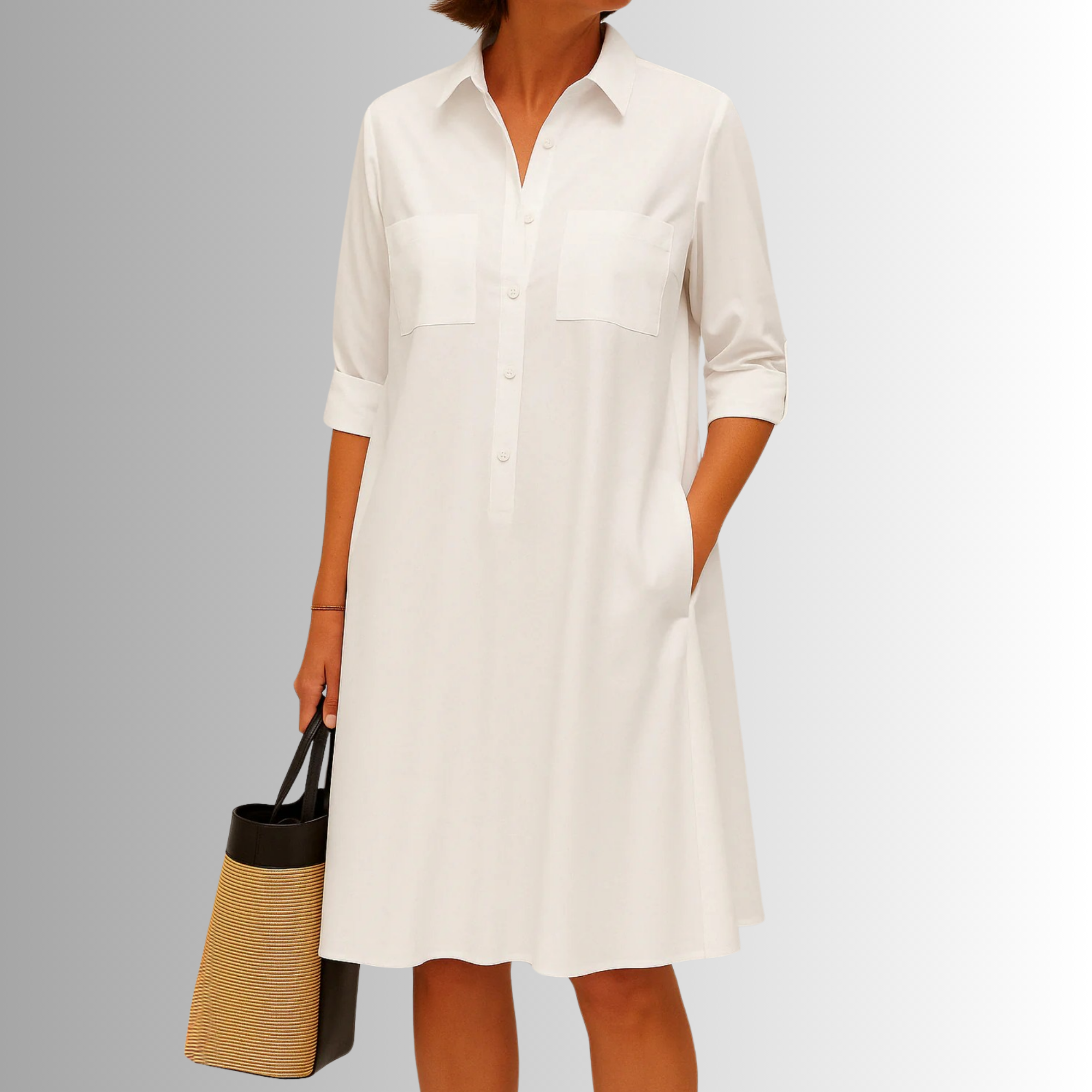 White button-down A-line dress with collar, front buttons, and chest pockets.