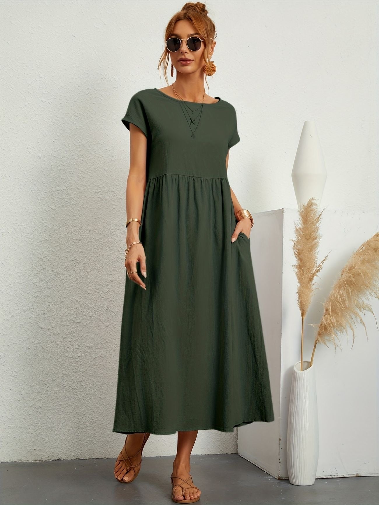 Olive green midi maxi dress with gathered smocked bodice and short sleeves, loose fit