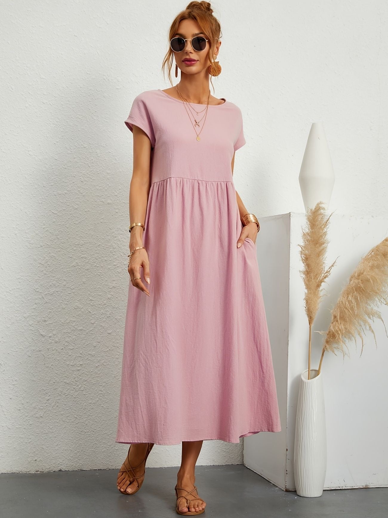 Light pink maxi dress with gathered smocked bodice and short sleeves, loose fit