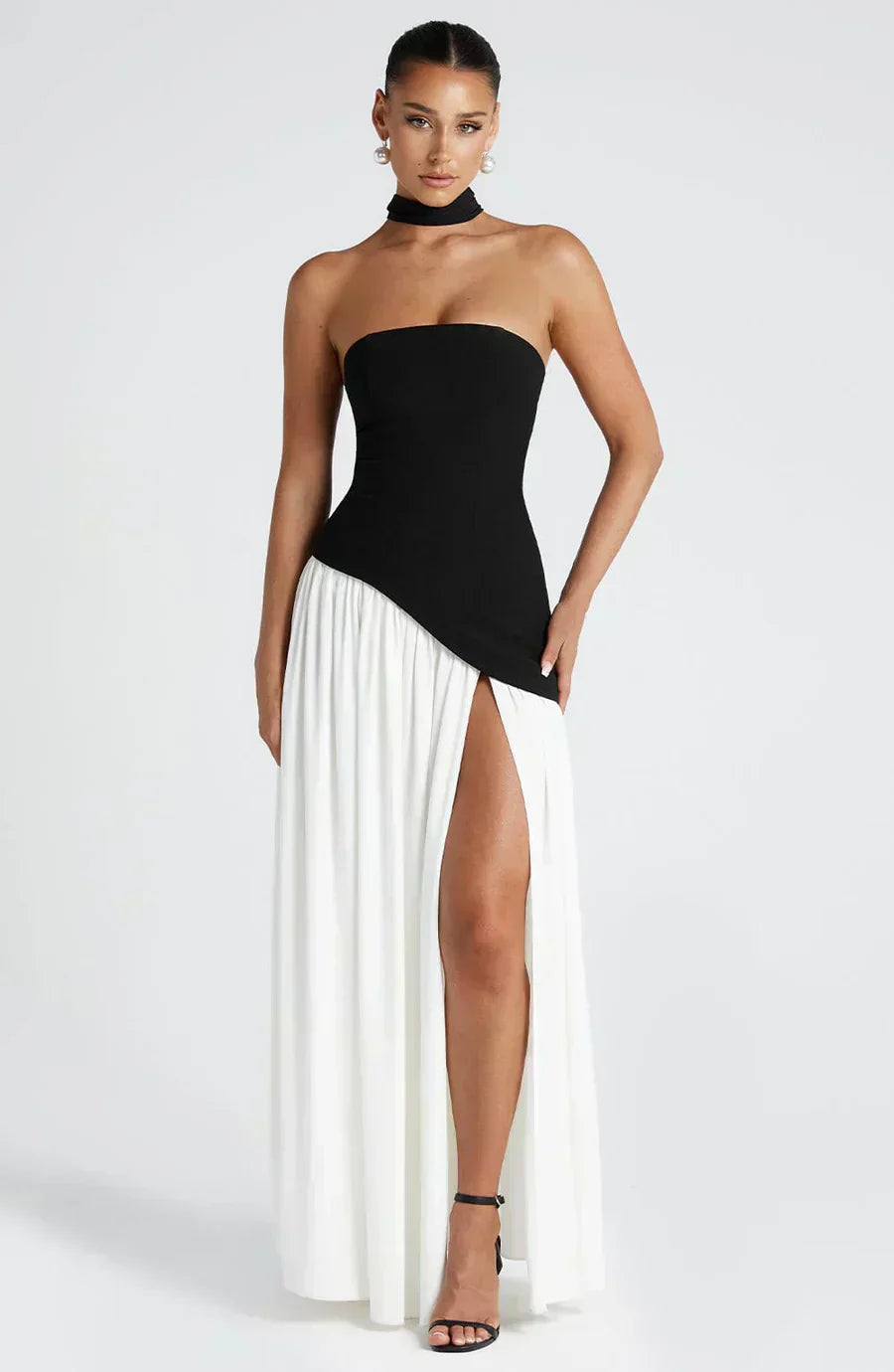Black strapless asymmetric maxi dress with fitted corset top and high leg slit