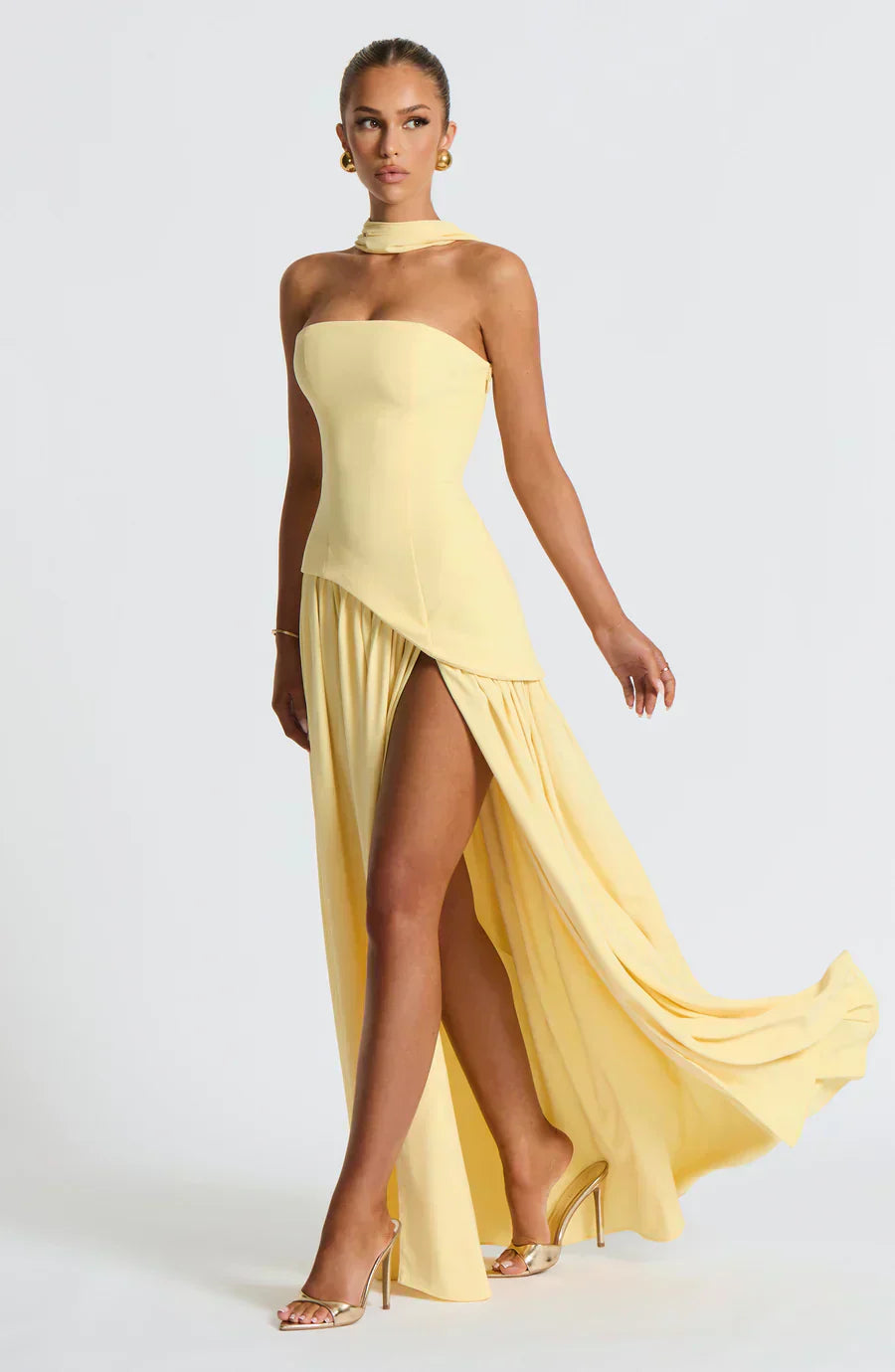 Yellow strapless maxi dress with asymmetric draped bodice and side slit