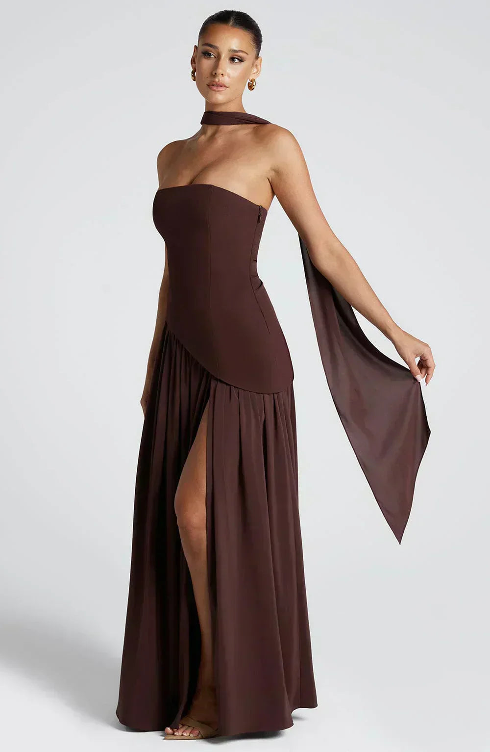 Dark brown strapless maxi dress with layered draped skirt and side opening