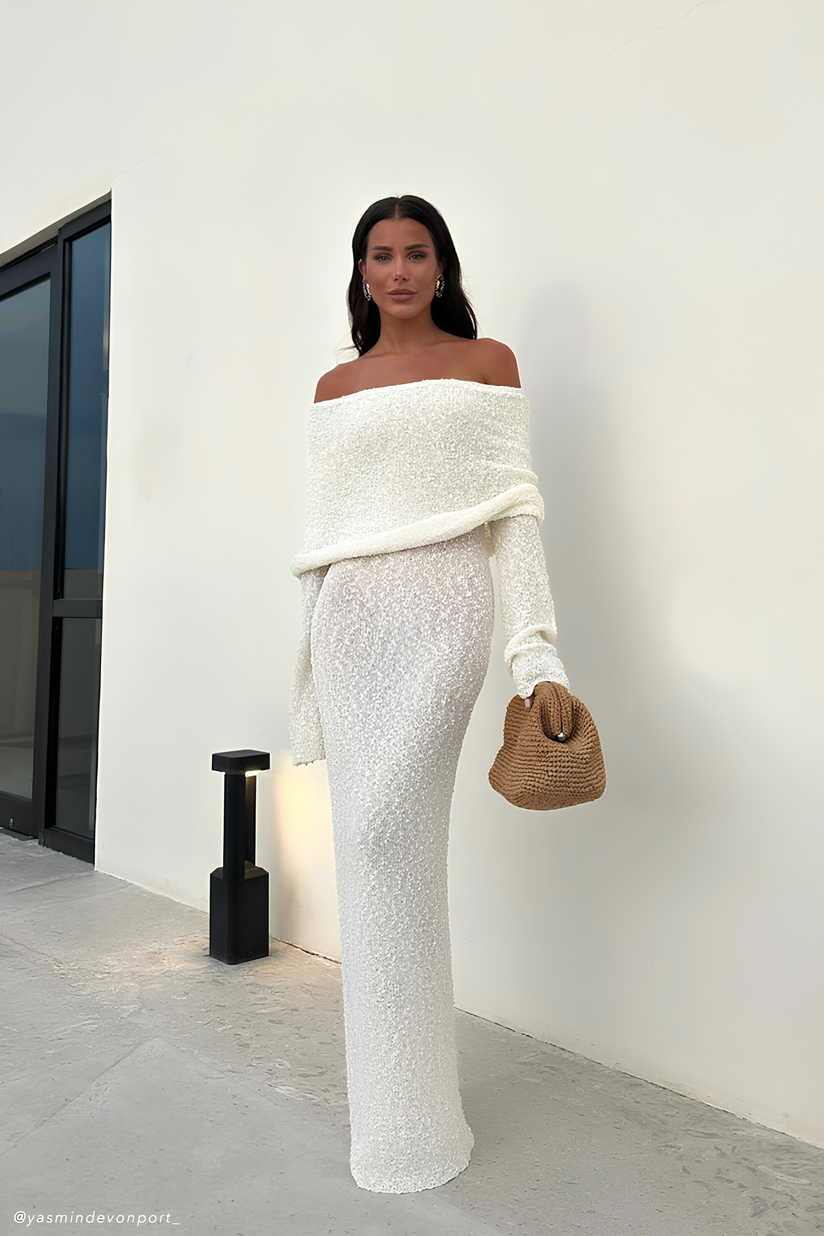 Off-white off-shoulder knit maxi dress with long sleeves and folded drape over neckline