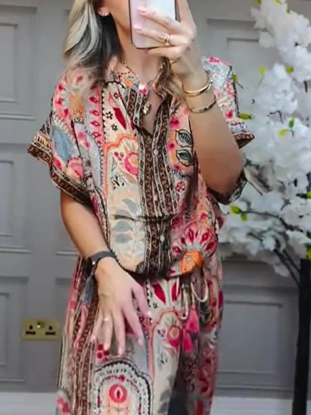 Red boho paisley blouse with button-front V-neck and tie waist detail