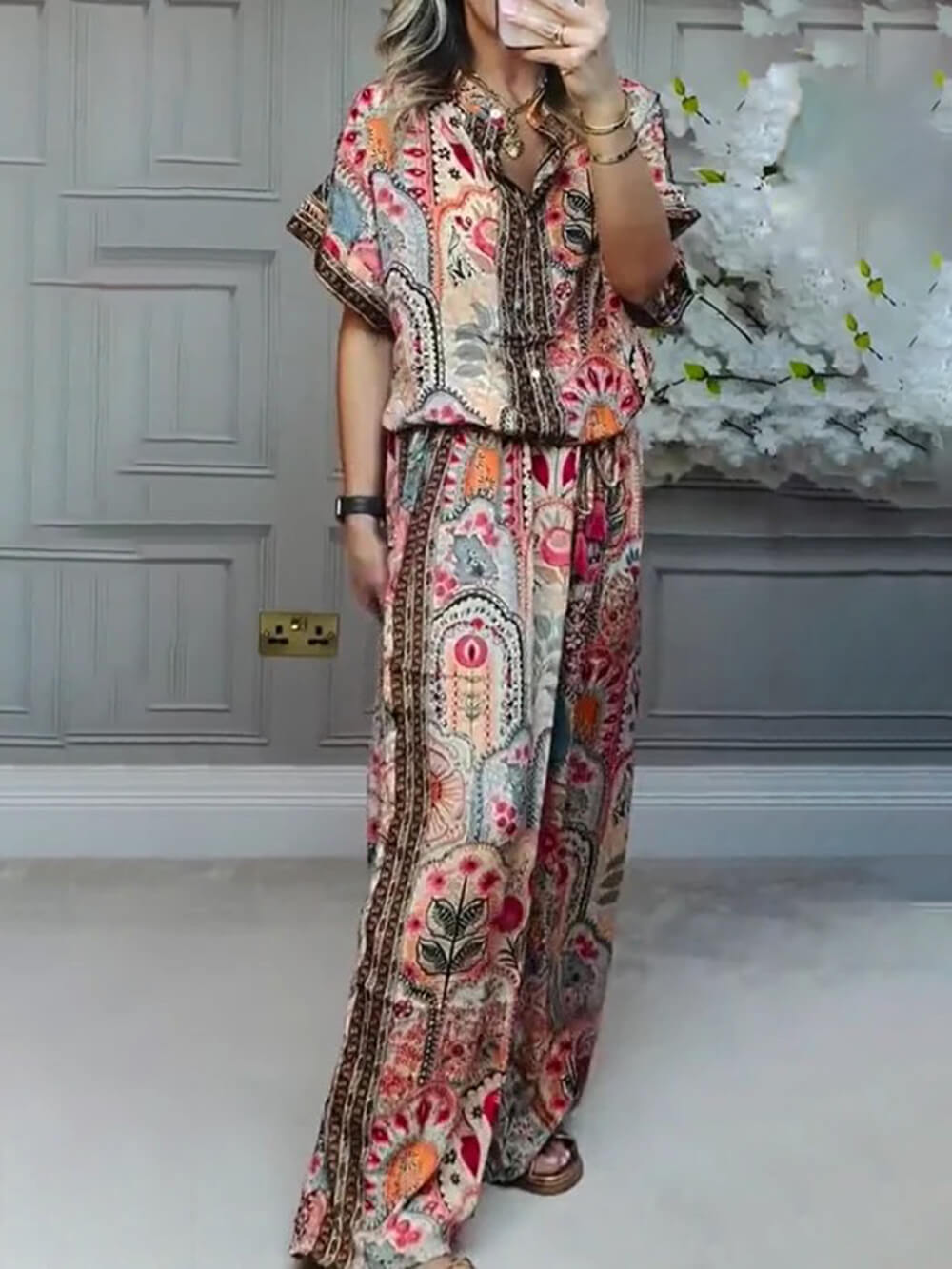 Red button-front boho paisley blouse with short sleeves and V-neck collar