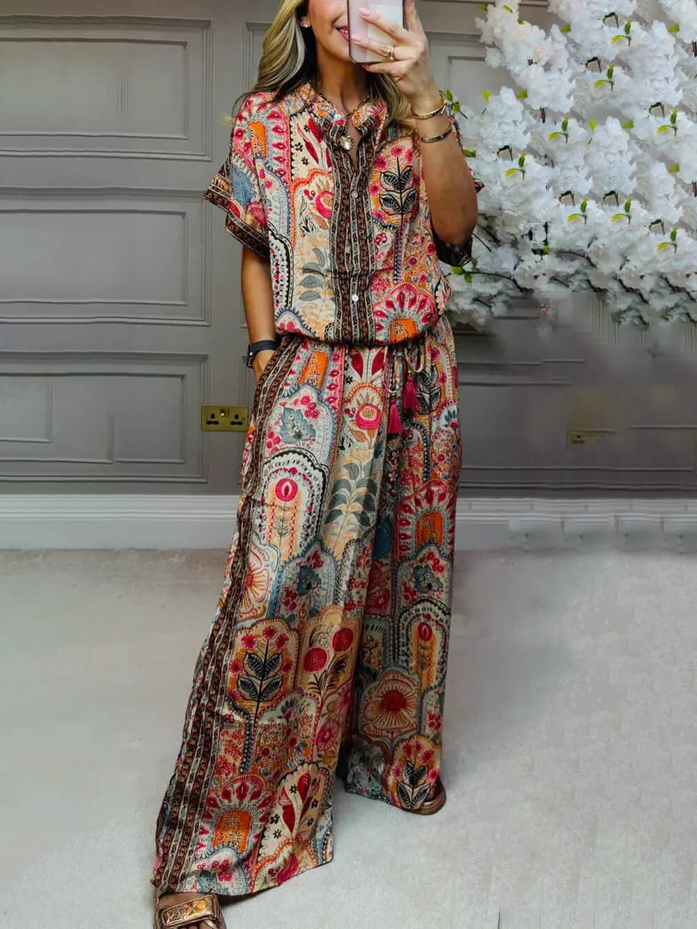Red boho paisley blouse with short sleeves, button-front, and collar detail