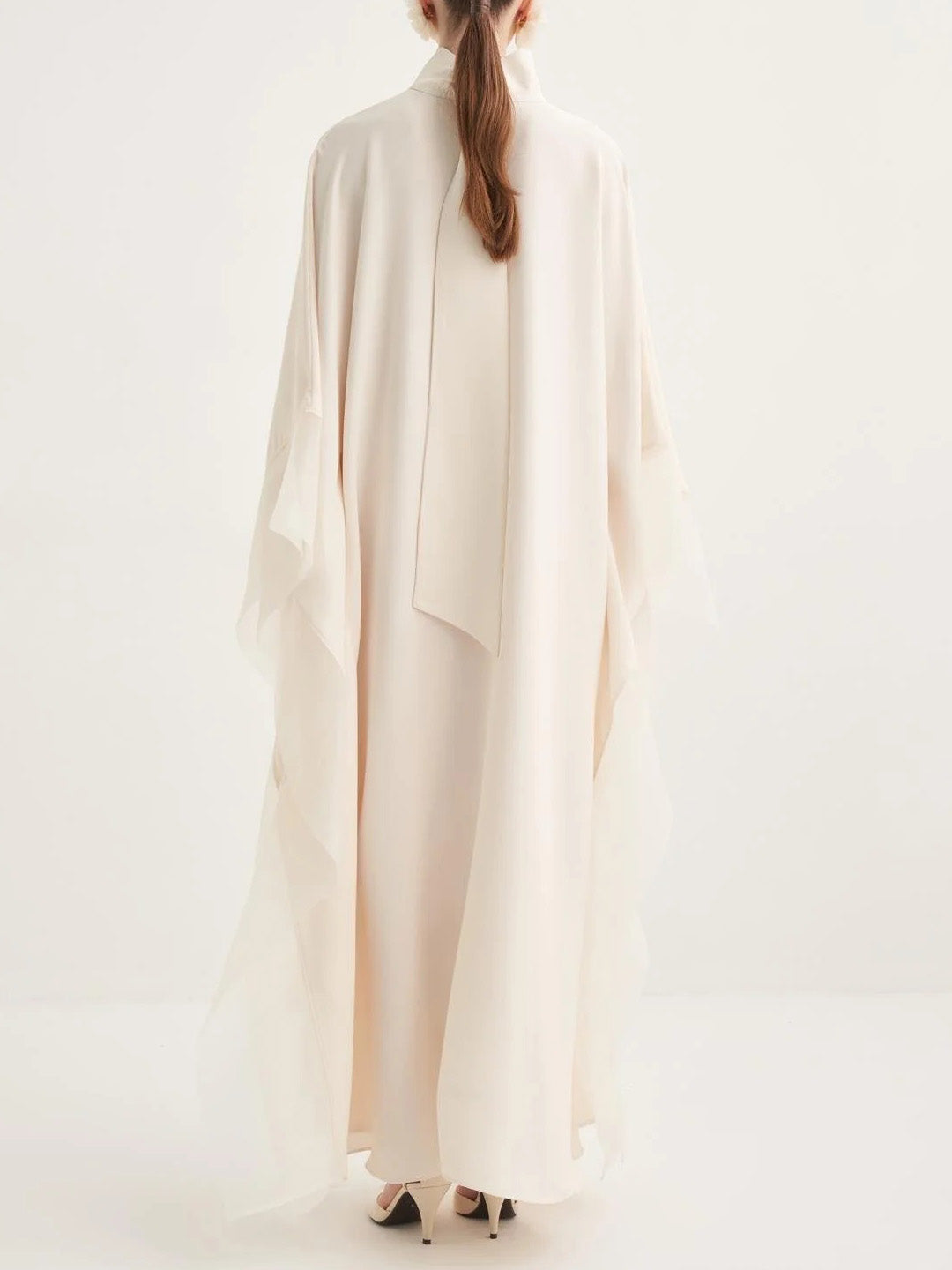 Cream satin kaftan maxi dress with high neck and loose batwing sleeves, back view