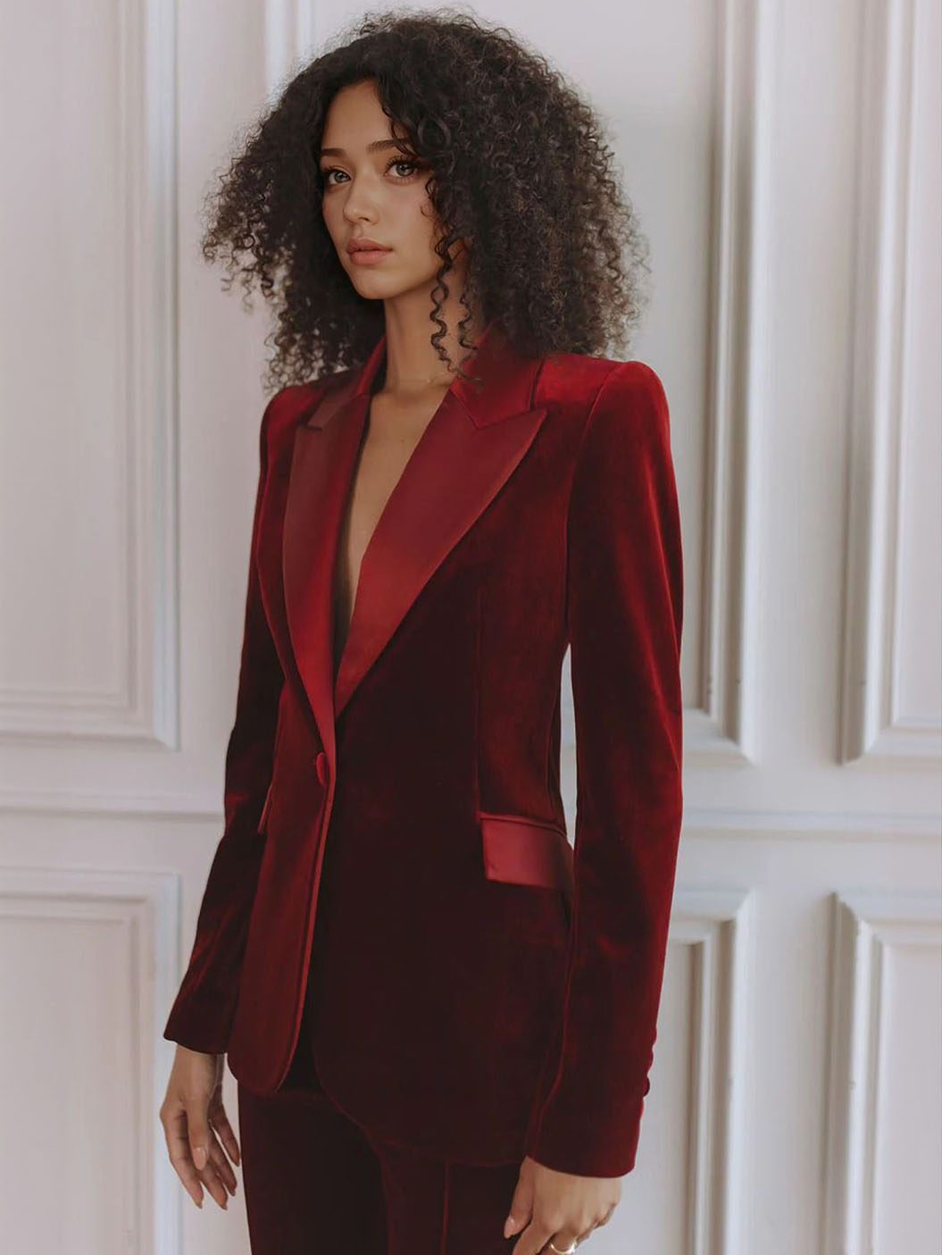 Women’s red velvet blazer with satin lapel trim, fitted waist and chest pocket detail
