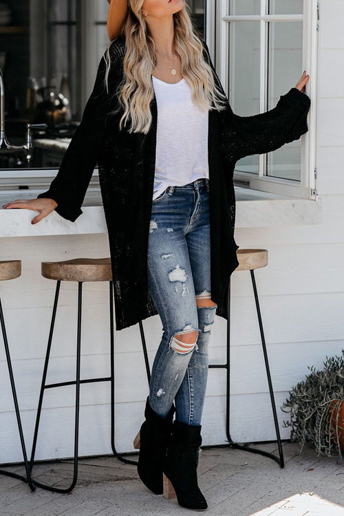 Long sleeve knit cardigan in black with open front and long draped sleeves