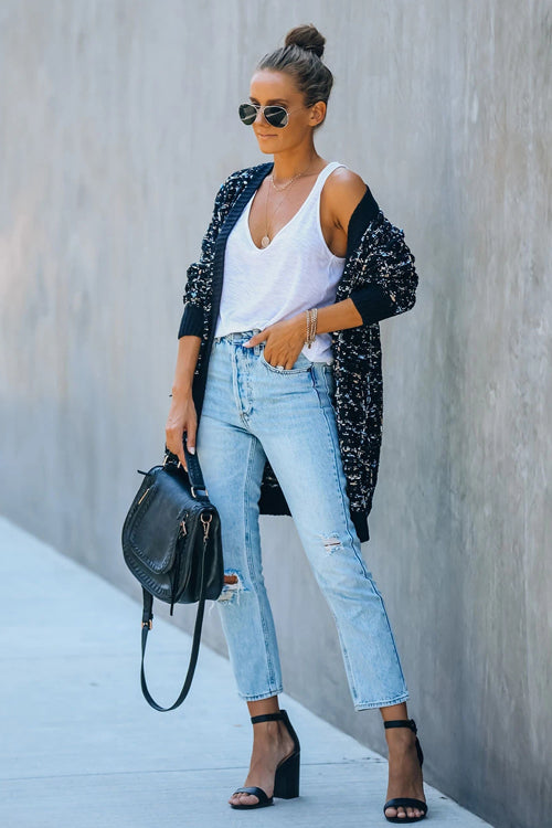 Navy speckled knit cardigan worn open over white tank, long sleeves