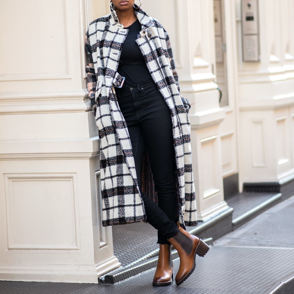 Brown chelsea boots with dark elastic panels and block heel under black pants