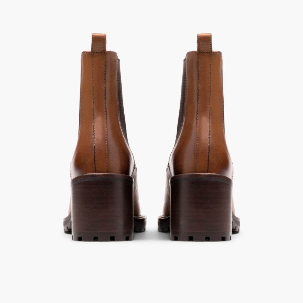 Brown chelsea boots rear view with pull tabs and chunky block heel