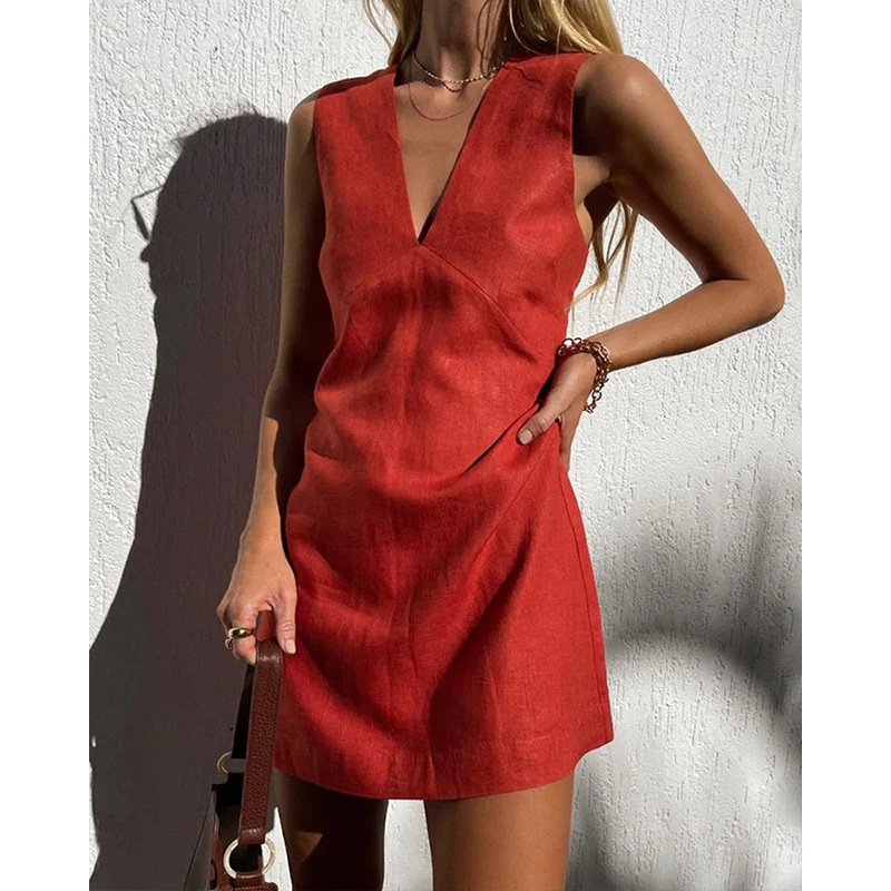 Sleeveless red mini dress with deep V neckline and seam panel detail