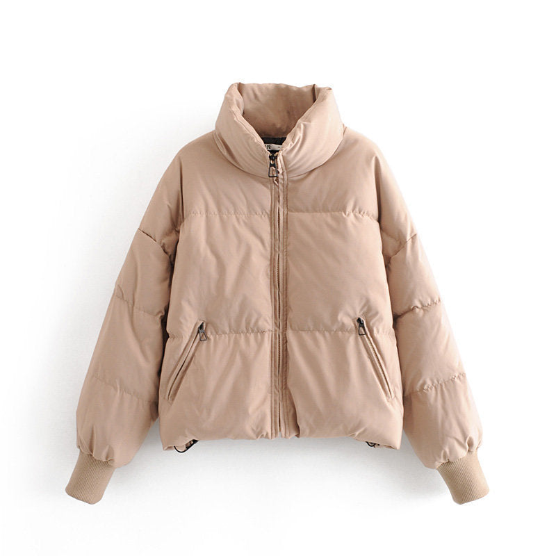 Women's beige zip-front puffer jacket with stand collar and zip side pockets