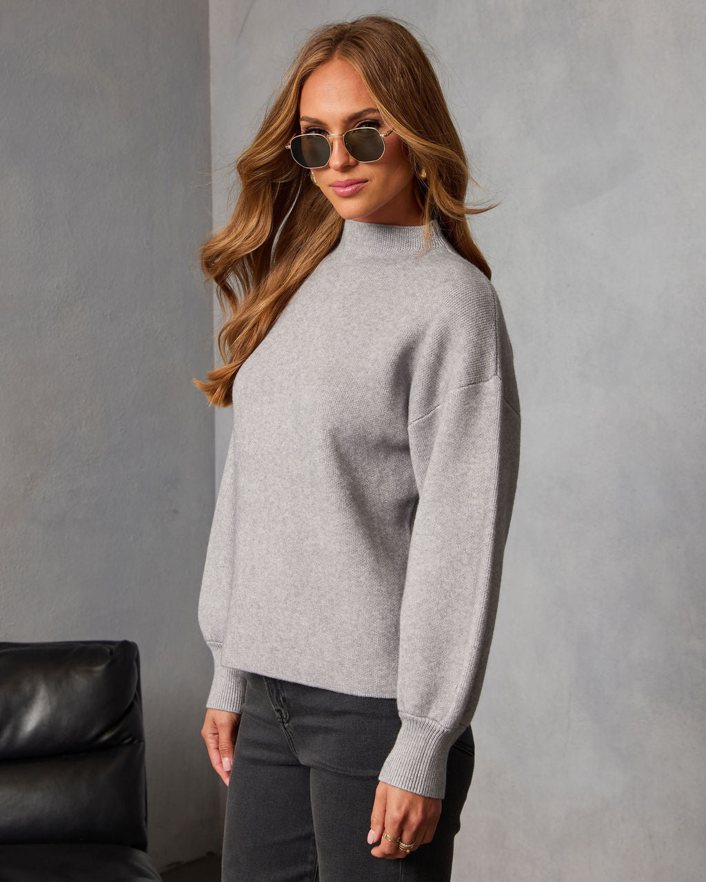 Heather grey mock neck sweater with long sleeves and ribbed hem