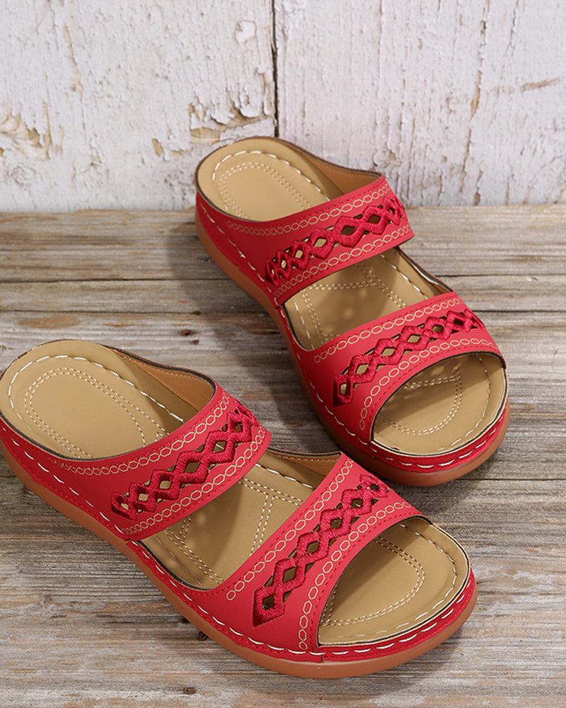 Red faux-leather flatform slide sandals with embroidered cutout strap detail
