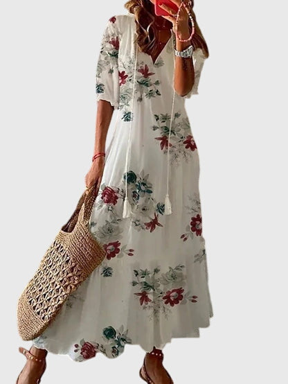 White boho summer dress with short sleeves and red floral print, tiered skirt