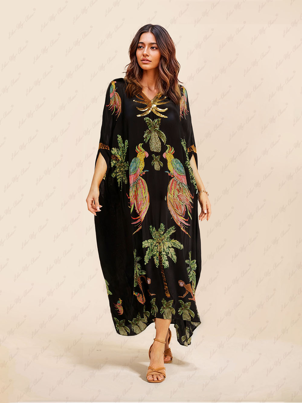 Black tropical print kaftan maxi dress with V-neck and gold sequin trim, loose fit.