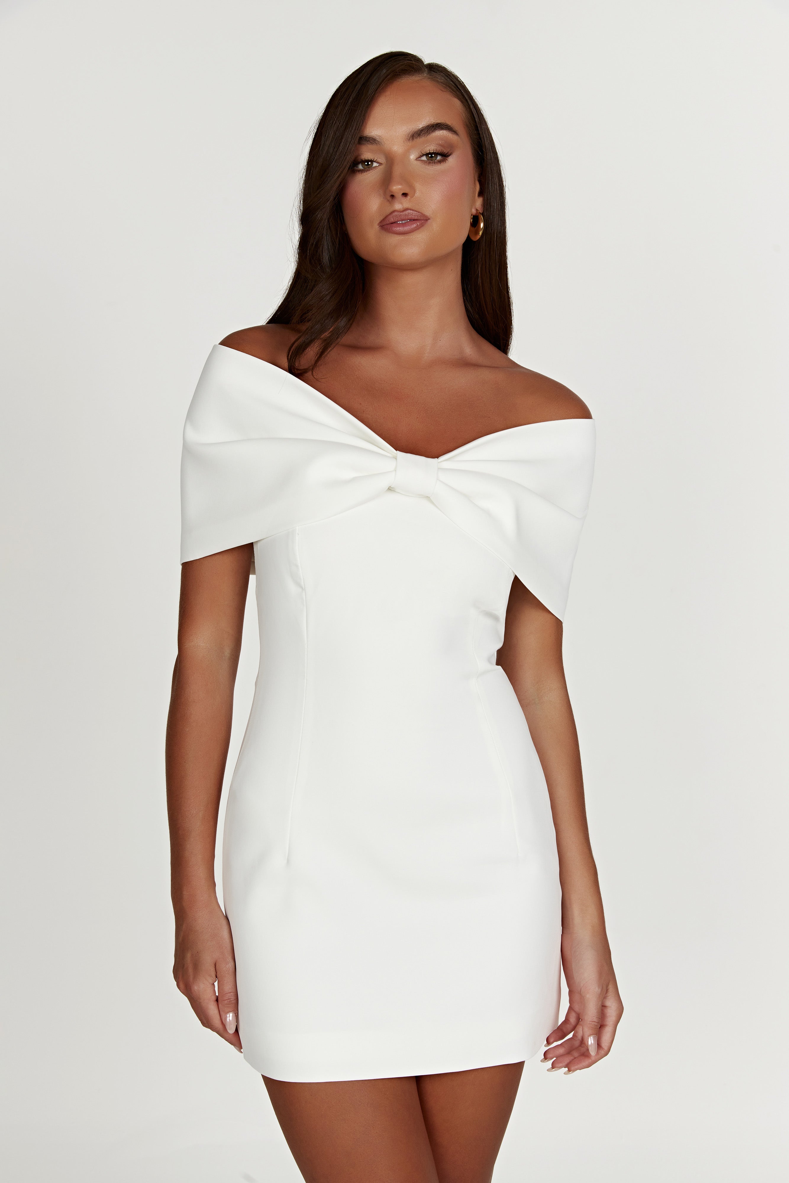 White off-shoulder satin mini bodycon dress with front bow at neckline