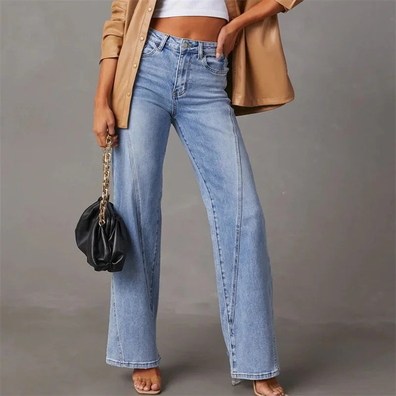 Women's high-rise blue flare jeans with front seam and slightly faded thigh