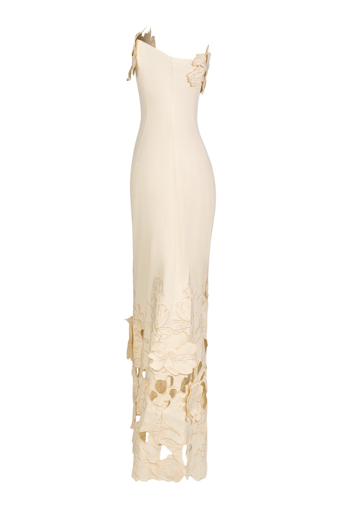 Cream strapless bodycon maxi dress on white background with floral appliques at skirt