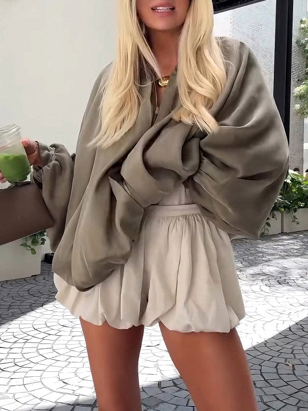 Cream satin high-waist bubble-hem mini shorts, gathered waist and flared ruffle hem