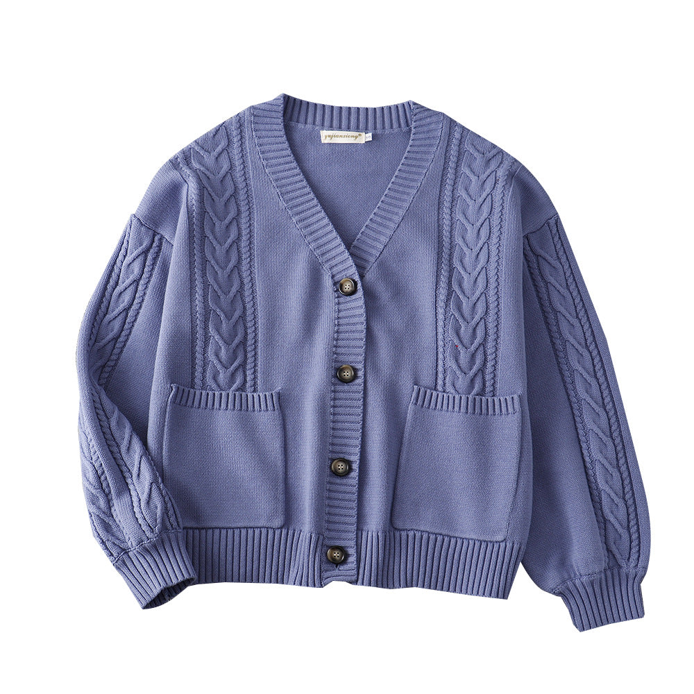 Women’s cable knit cardigan in blue with V-neck button front and patch pockets