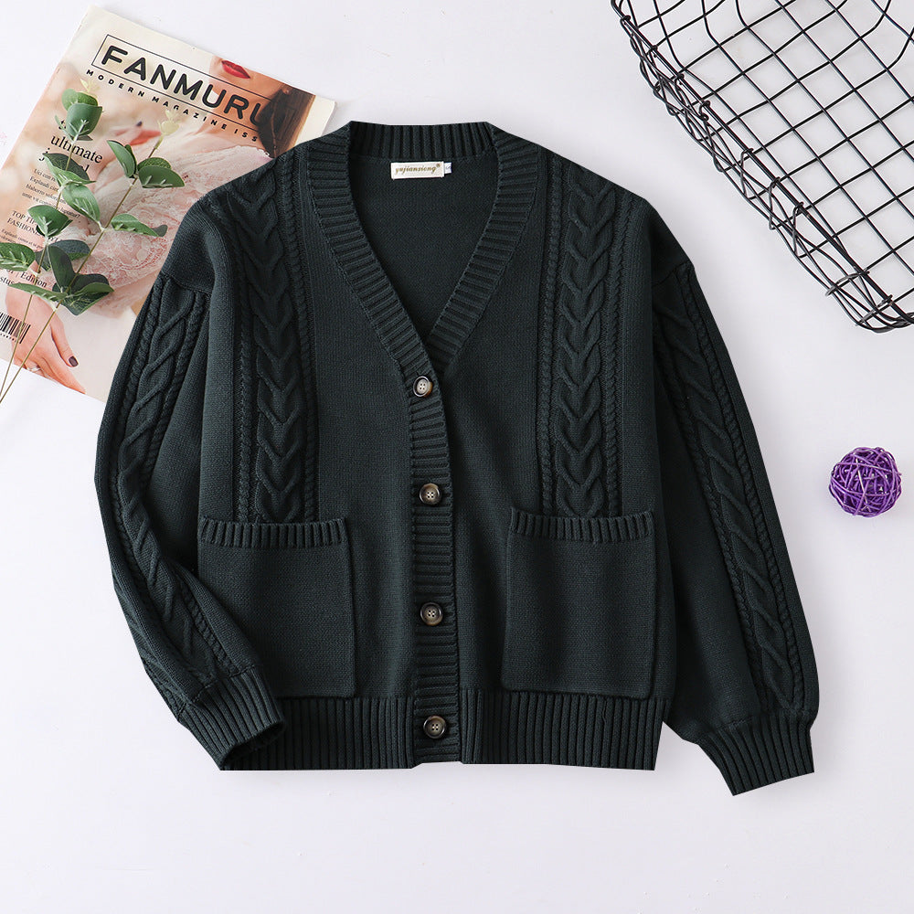 Women’s cable knit cardigan in black with V-neck button front and patch pockets