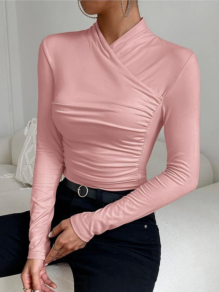 Light pink mock-neck long-sleeve top with ruched crossover wrap at waist