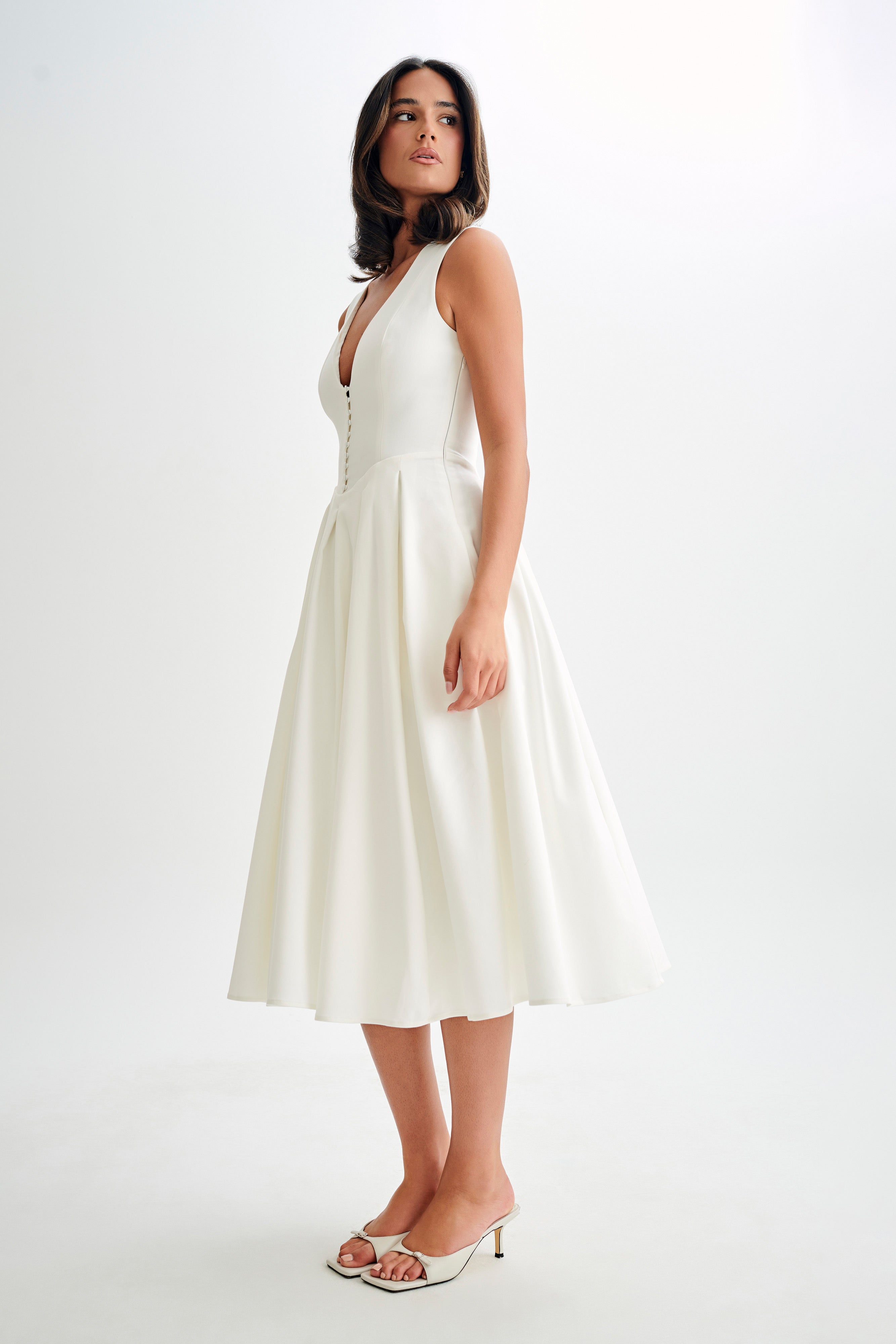 White satin A-line midi dress, sleeveless deep V with gathered waist and button detail