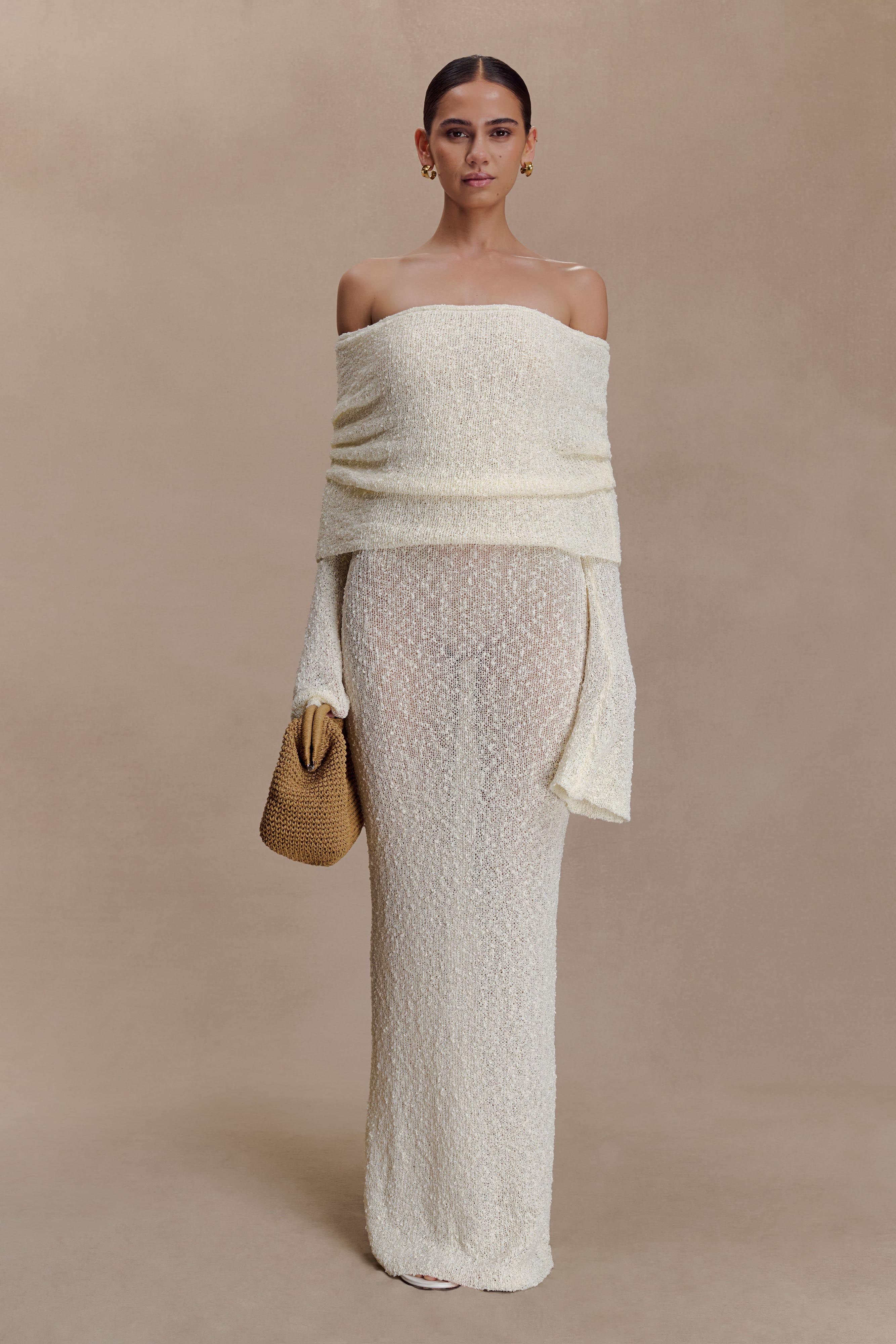 Off-white off-shoulder knit bodycon maxi dress with draped foldover and long cuffed sleeves