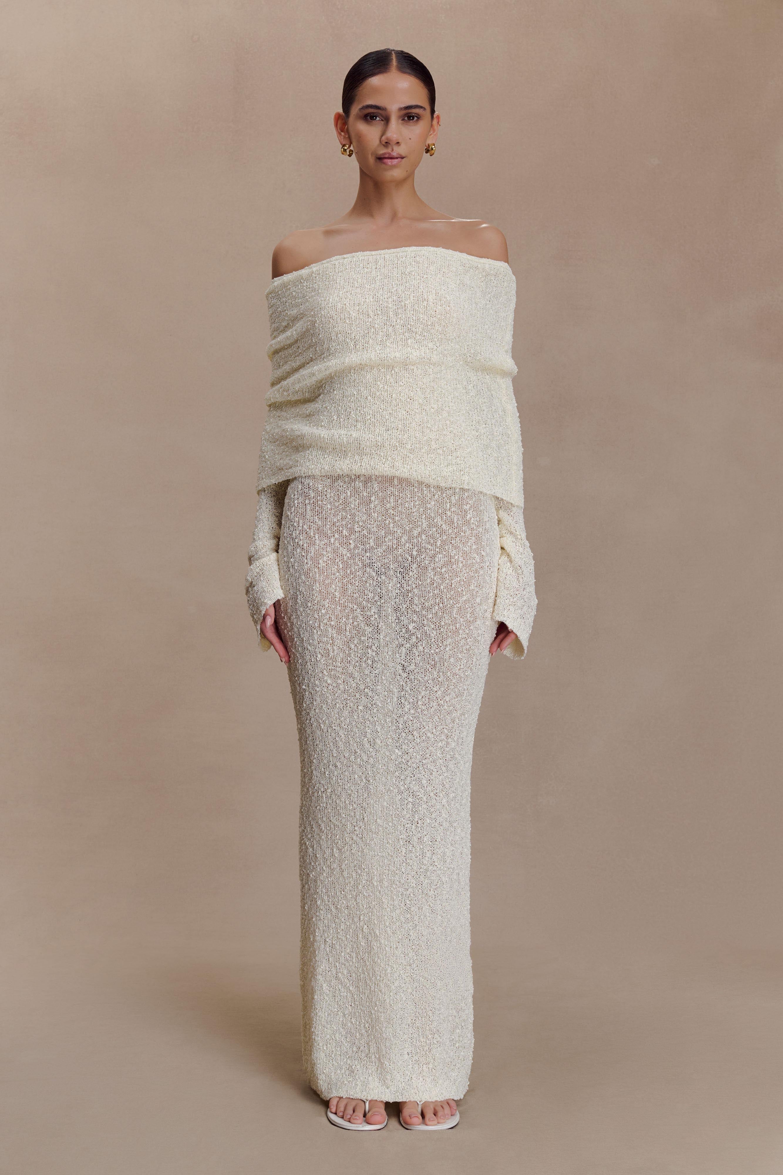 Off-white off-shoulder knit bodycon maxi dress with long sleeves and draped foldover