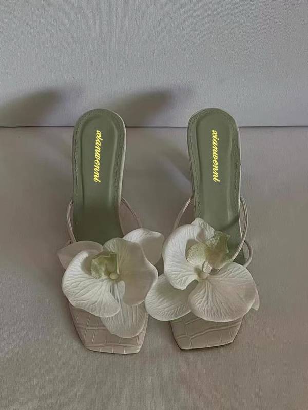 Pair of satin square-toe mule heels with large orchid appliqués