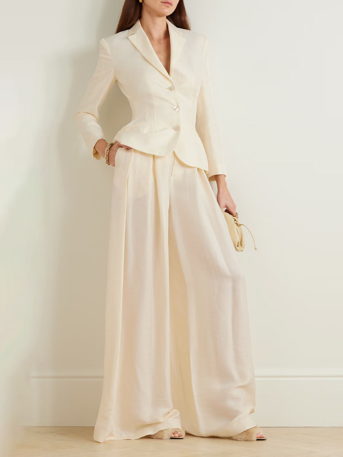 Cream fitted blazer with single button front and structured shoulders, full length view