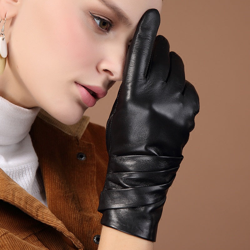 Black leather women’s gloves with curved palm seam and stitched wrist cuff