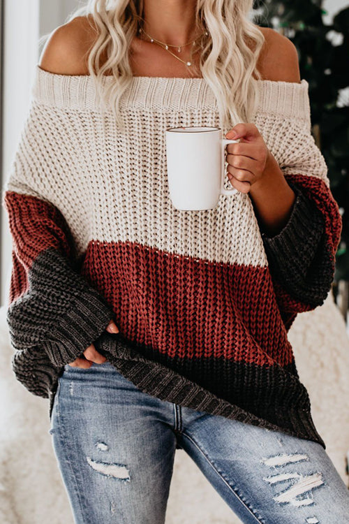 Striped knit off-shoulder sweater in cream, rust, and dark charcoal with ribbed cuffs