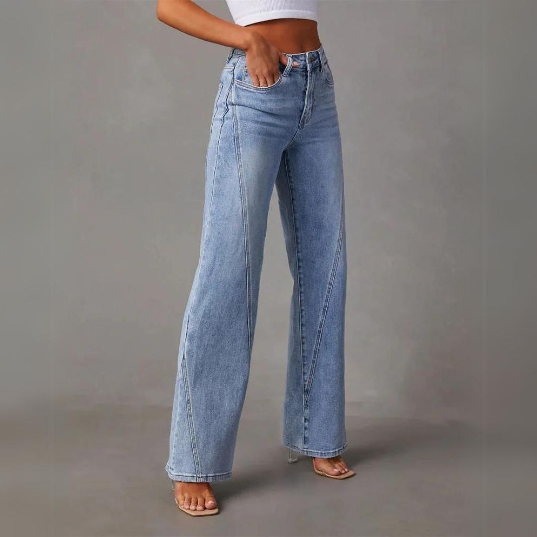 Women's high-rise blue flare jeans with visible front panel seam detail