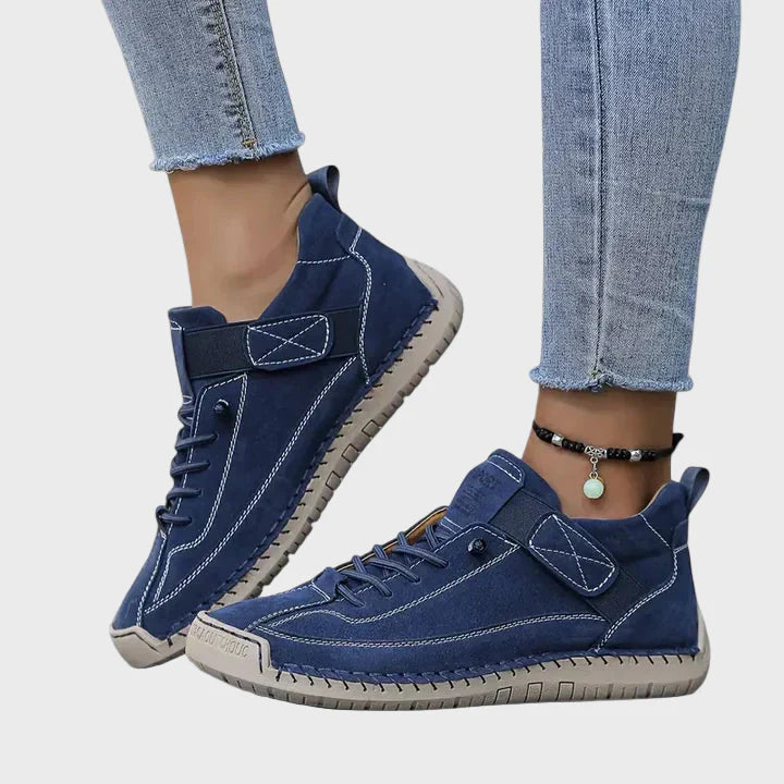 Navy faux leather lace-up sneakers with ankle strap and beige rubber sole