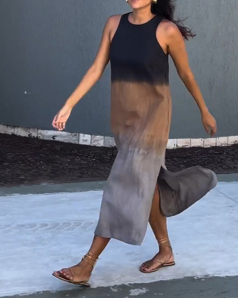 Sleeveless viscose ombre midi dress, crew neck and side slit, dark-to-gray gradient, walk pose.