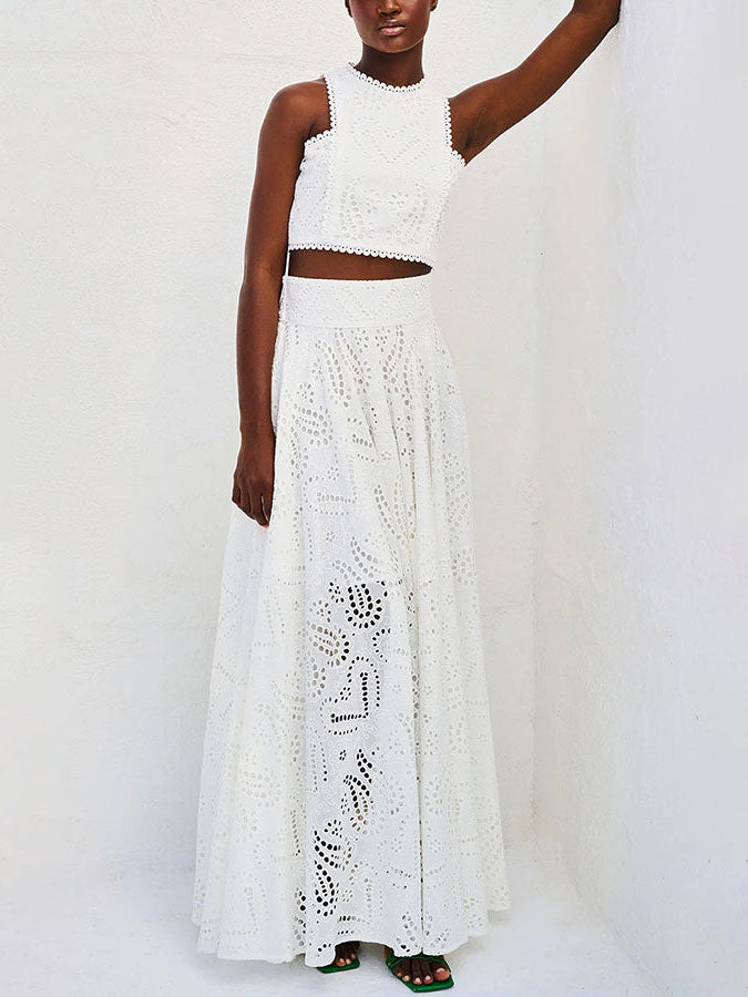 Cotton eyelet broderie skirt with smocked waist, pockets, and sweeping floor length