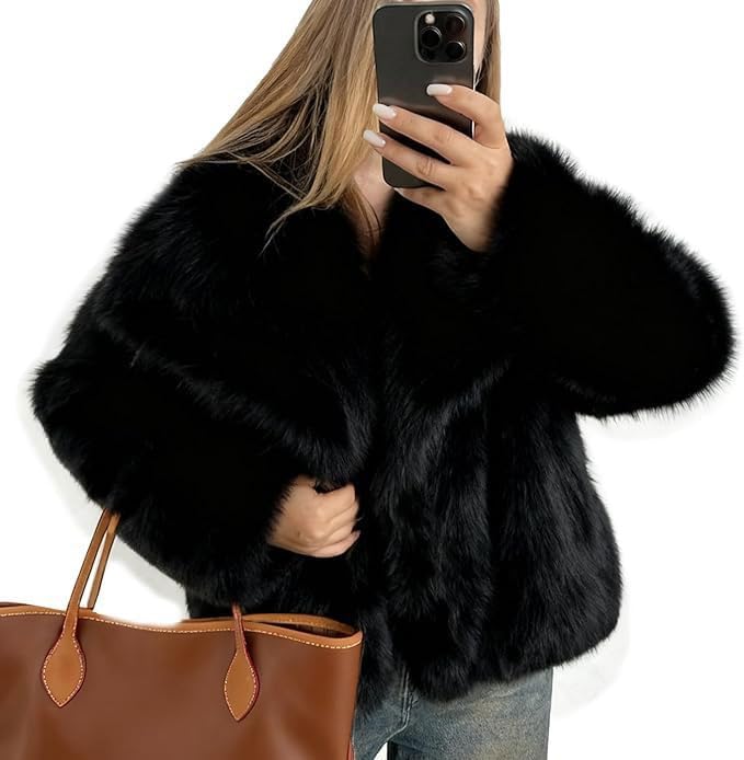 Black faux fur jacket with a wide collar and long sleeves
