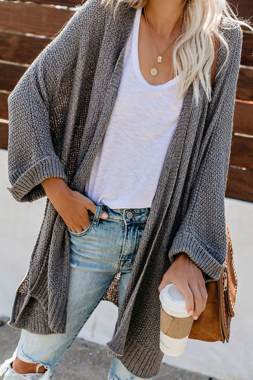 Long sleeve knit cardigan in grey with open front and textured drape