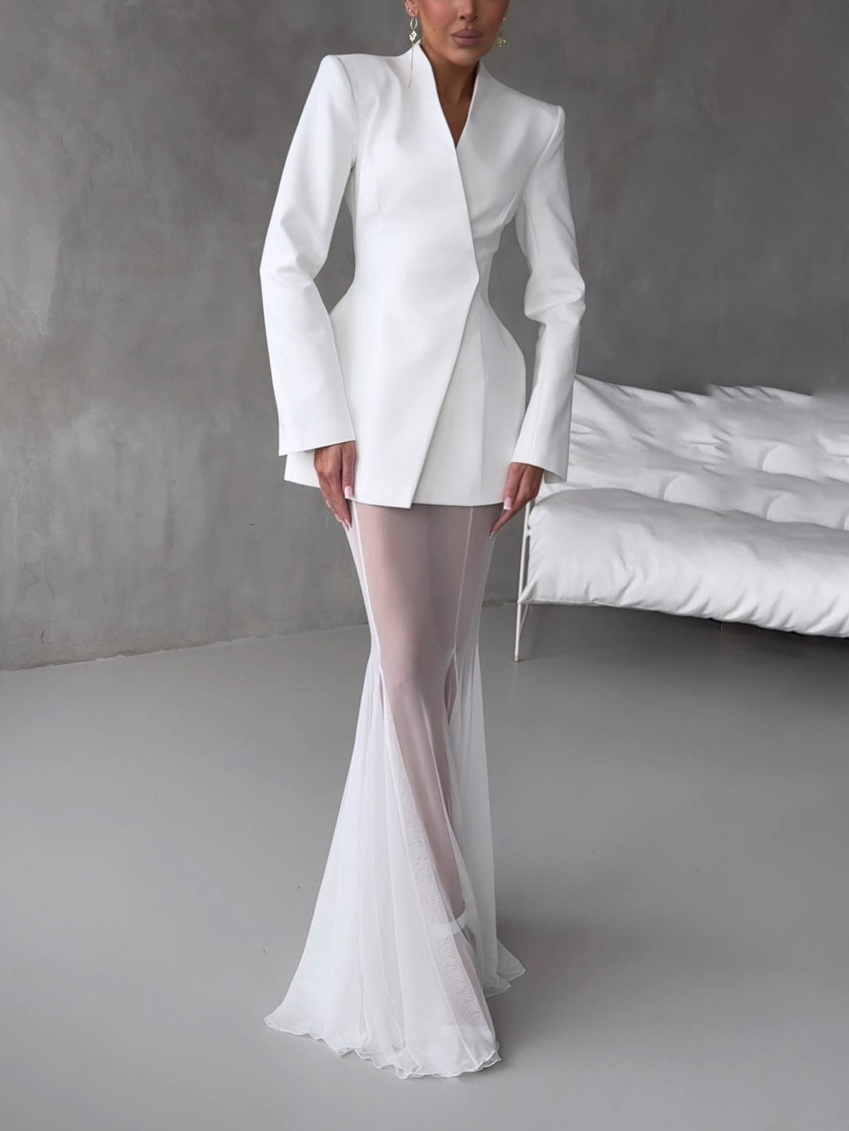 White sheer mesh flare-leg trousers with high waist and ruffled hem