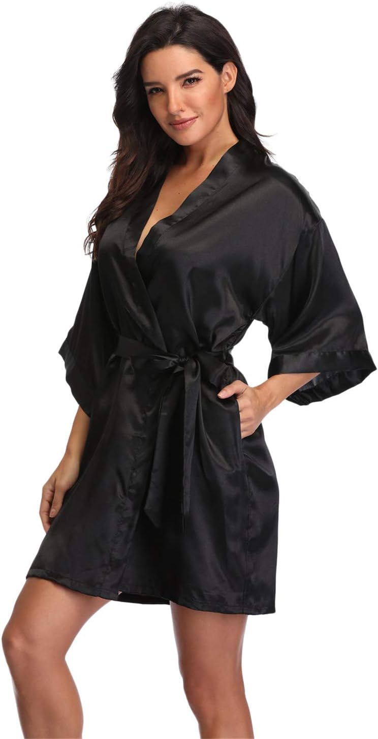 Women's black satin robe with a wrap front, wide sleeves, tie belt and pockets