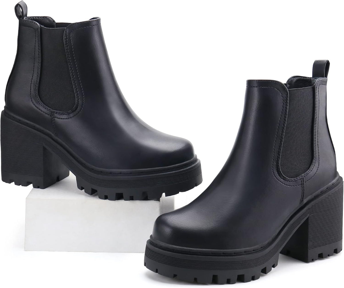 Pair of black Chelsea boots with tall block heels and thick lug soles