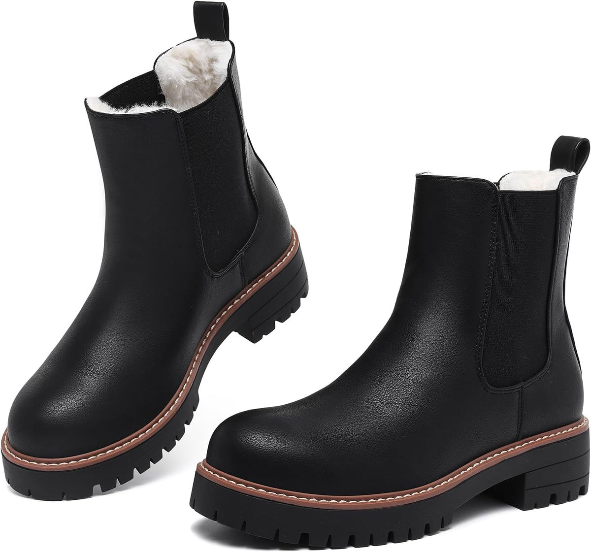 Black fur-lined Chelsea ankle boots with elastic side panels and chunky lug soles