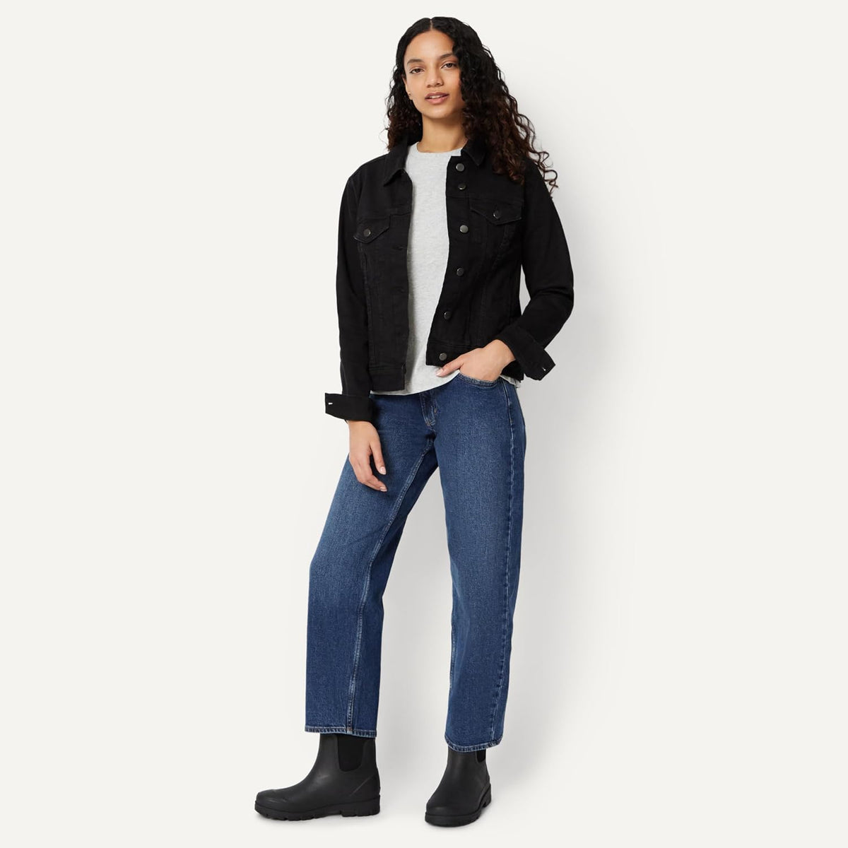 Black Chelsea ankle rain boots worn with jeans