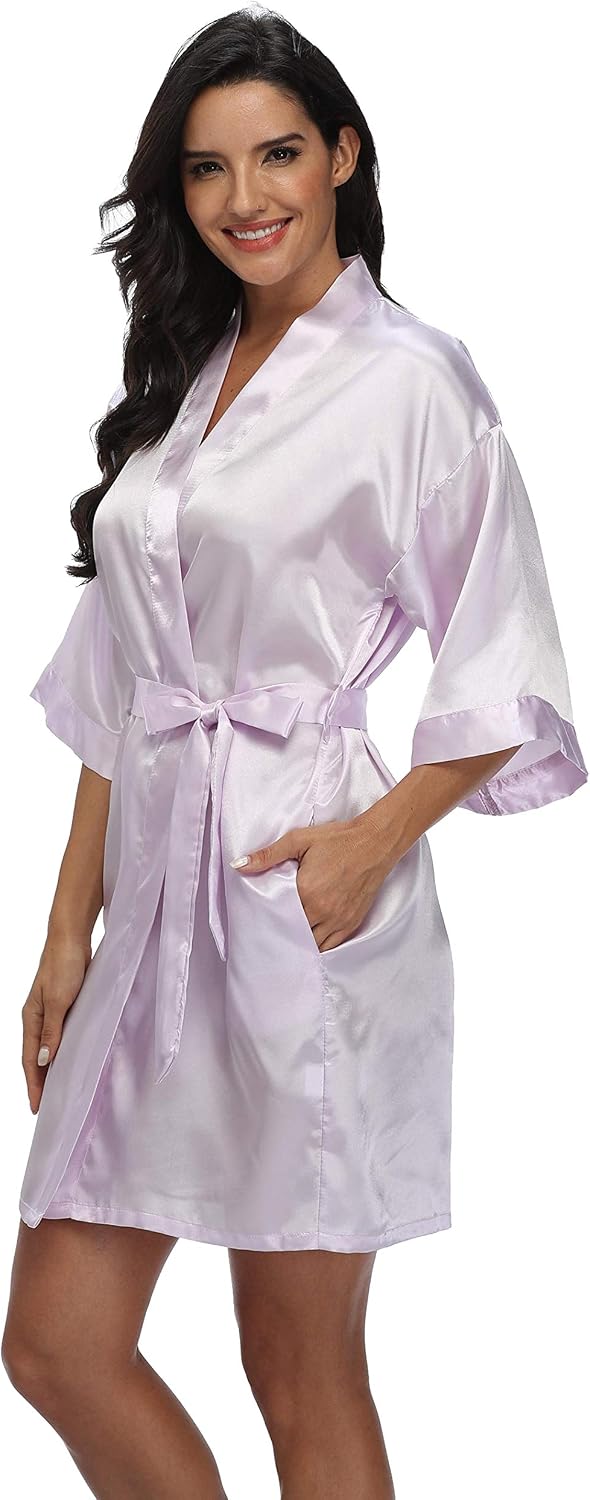 Women's pale lavender satin robe with a wrap front, wide sleeves, tie belt and pockets