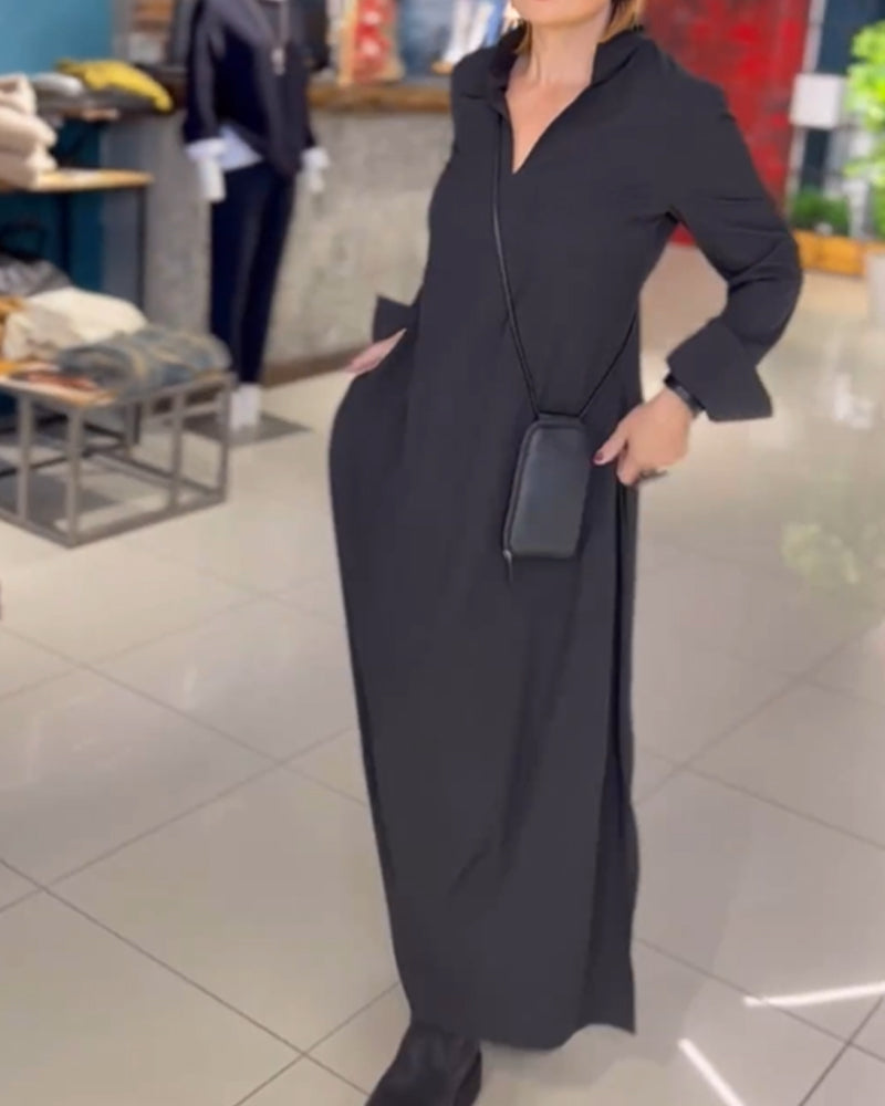 Black long-sleeve maxi dress with stand collar and side pockets, loose silhouette
