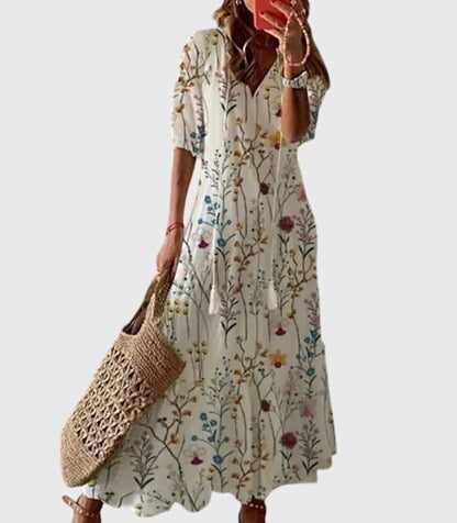 Cream boho summer dress with short sleeves and colorful botanical print, tiered skirt